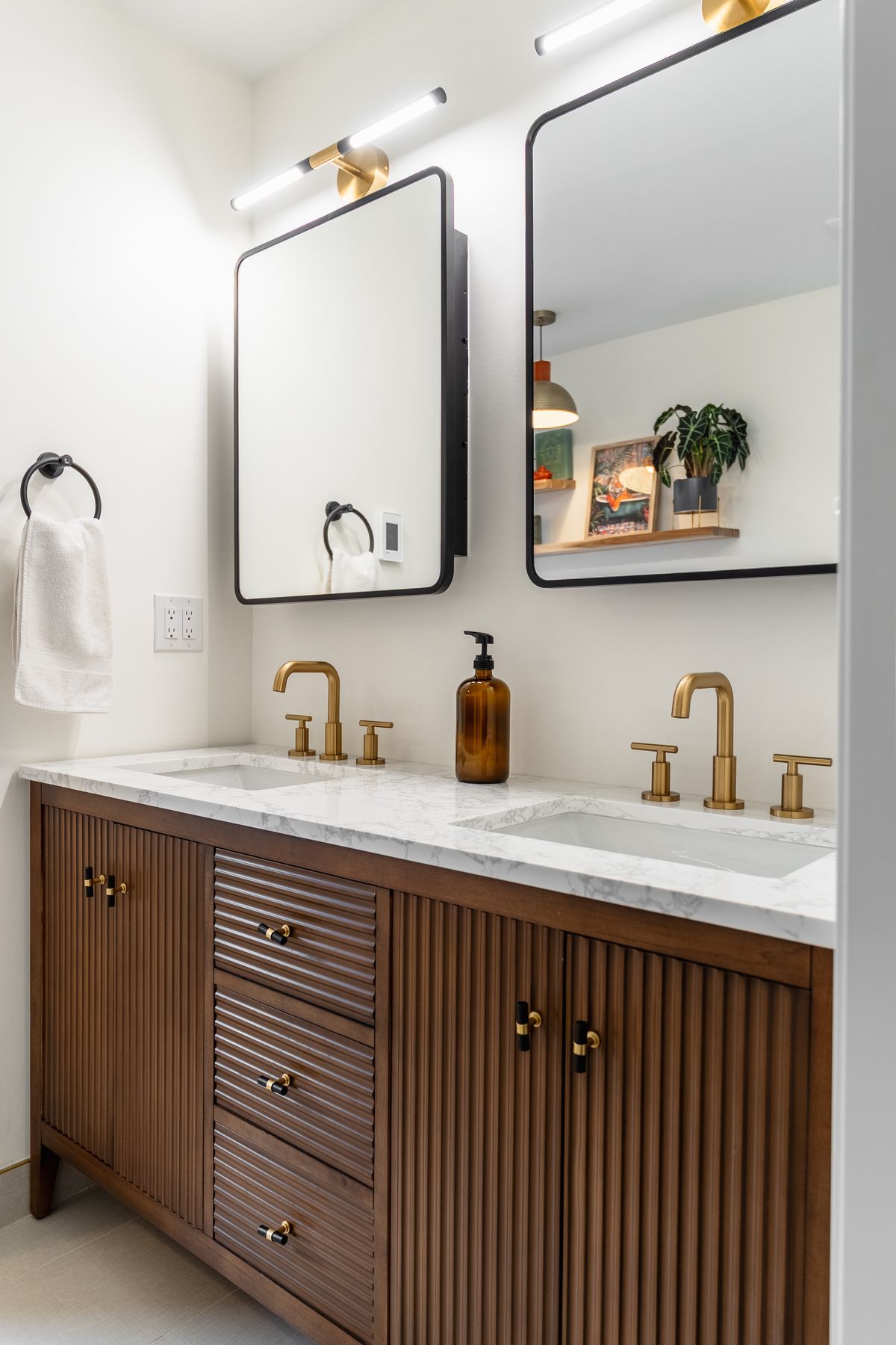 Marble bathroom renovation by Coronation Construction, photographed by Mike Mala