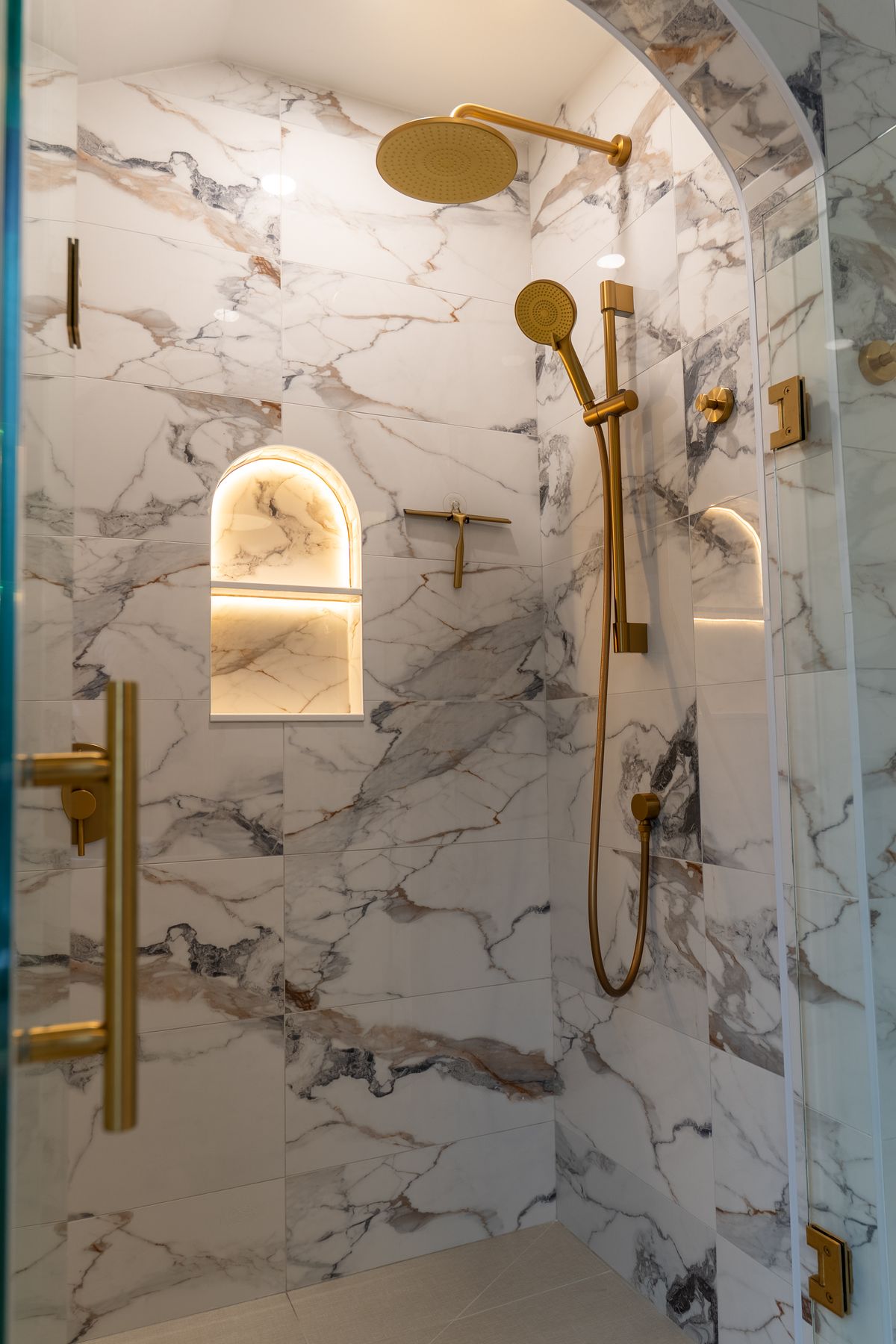 Marble bathroom renovation by Coronation Construction, photographed by Mike Mala