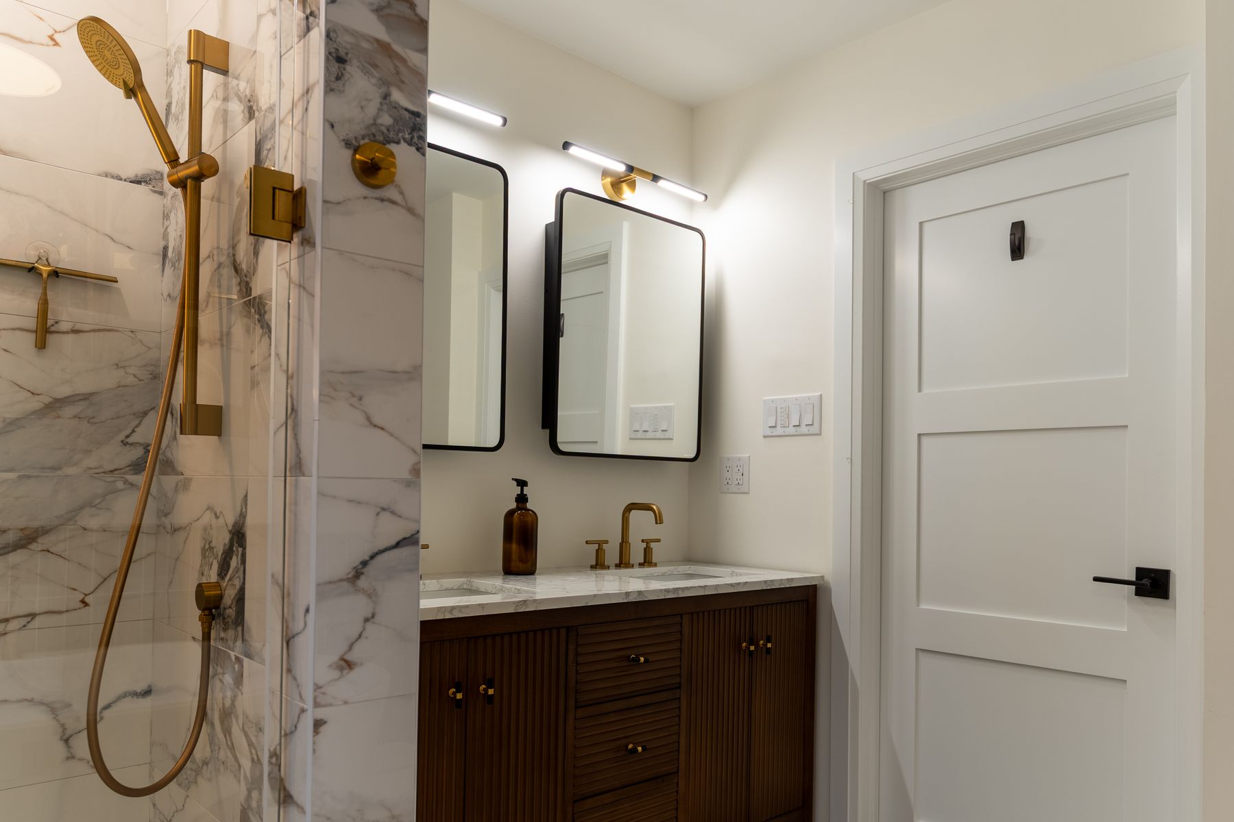 Marble bathroom renovation by Coronation Construction, photographed by Mike Mala