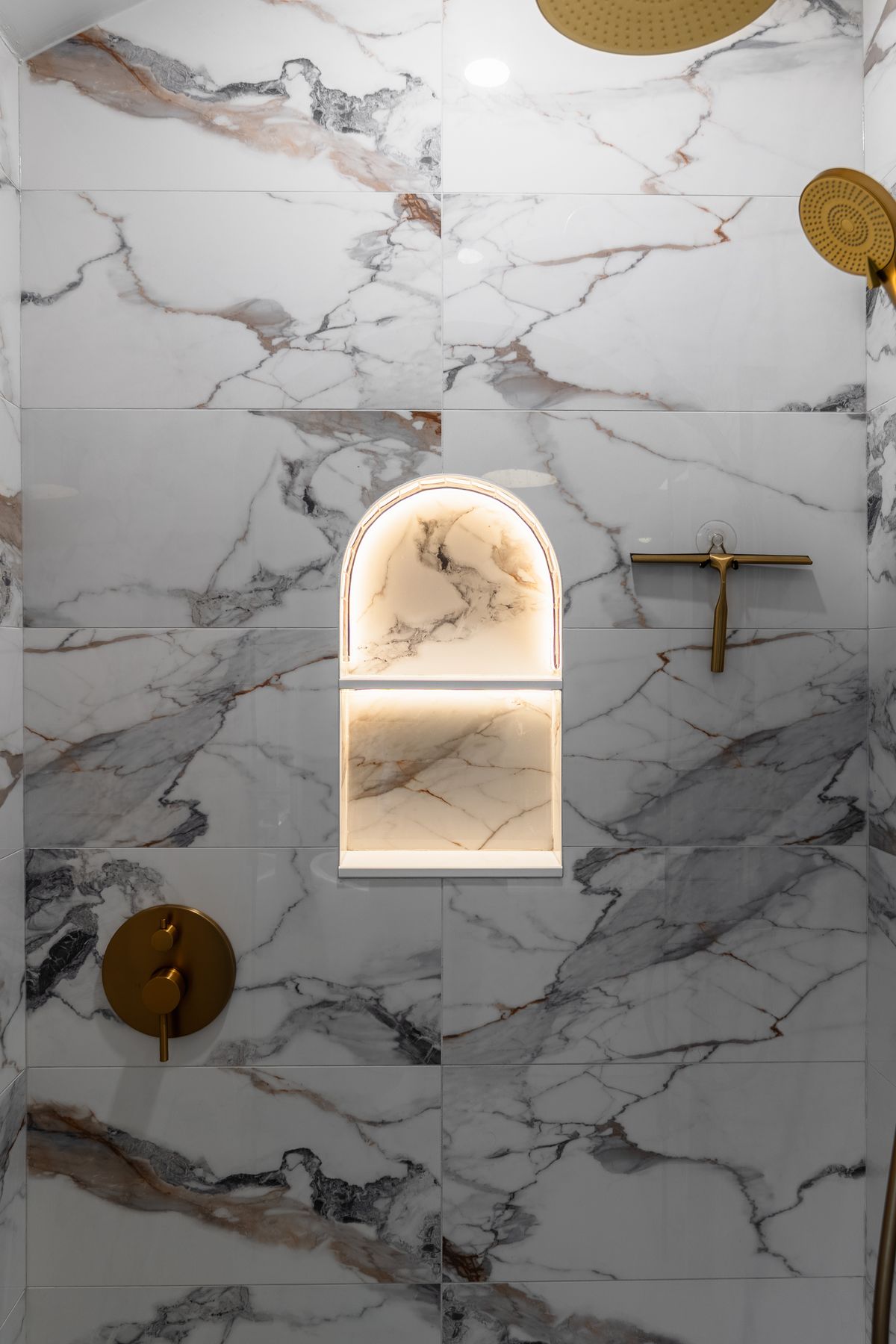 Marble bathroom renovation by Coronation Construction, photographed by Mike Mala