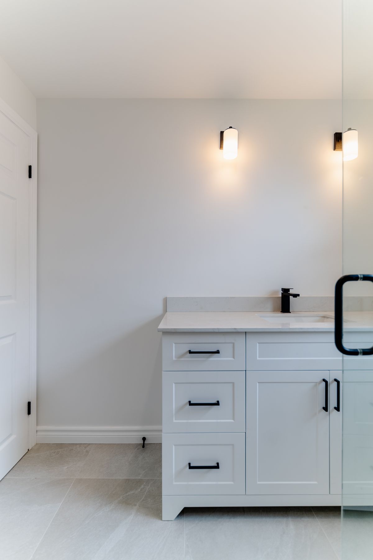 Herringbone tile bathroom renovation by Coronation Construction, photographed by Mike Mala