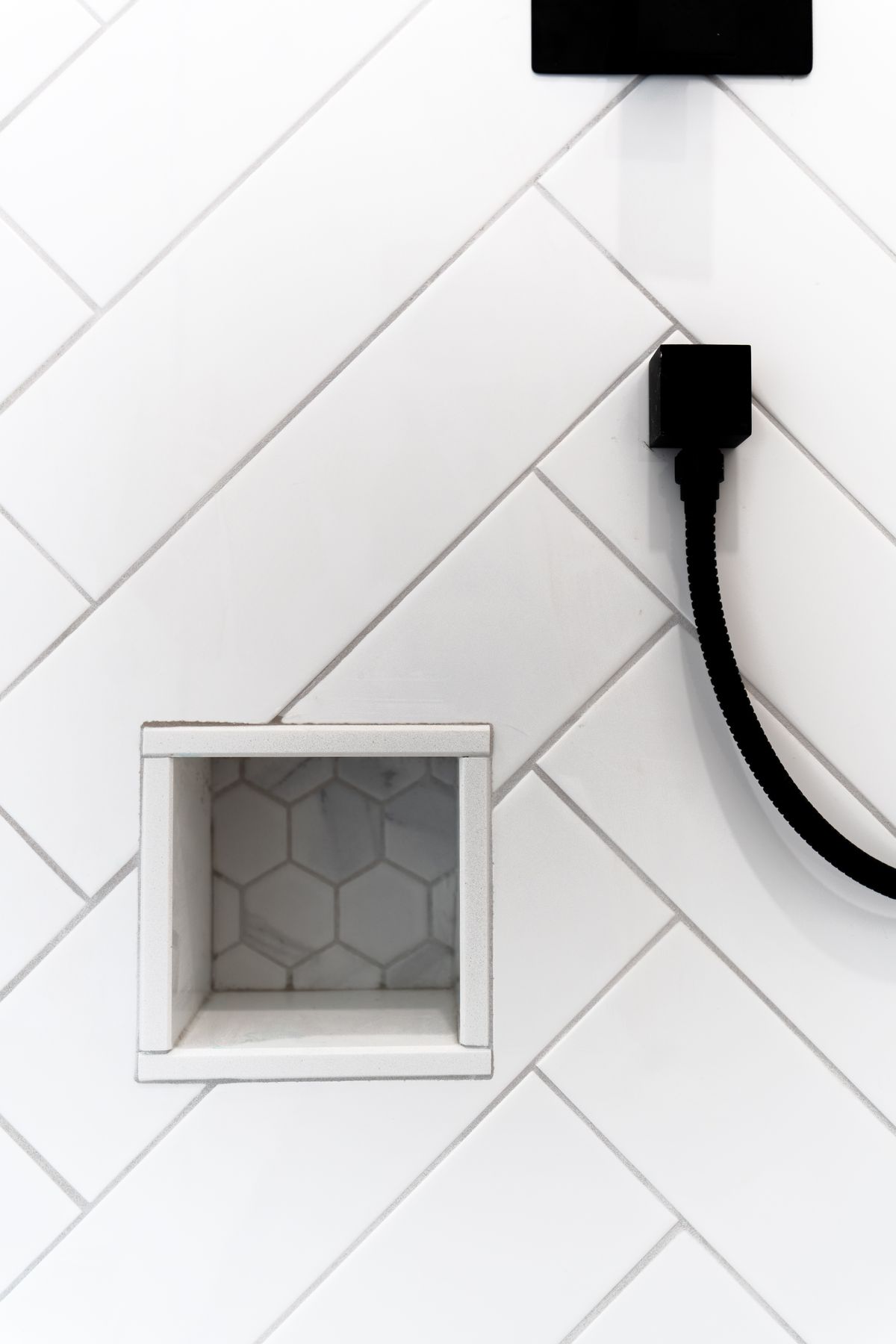 Herringbone tile bathroom renovation by Coronation Construction, photographed by Mike Mala