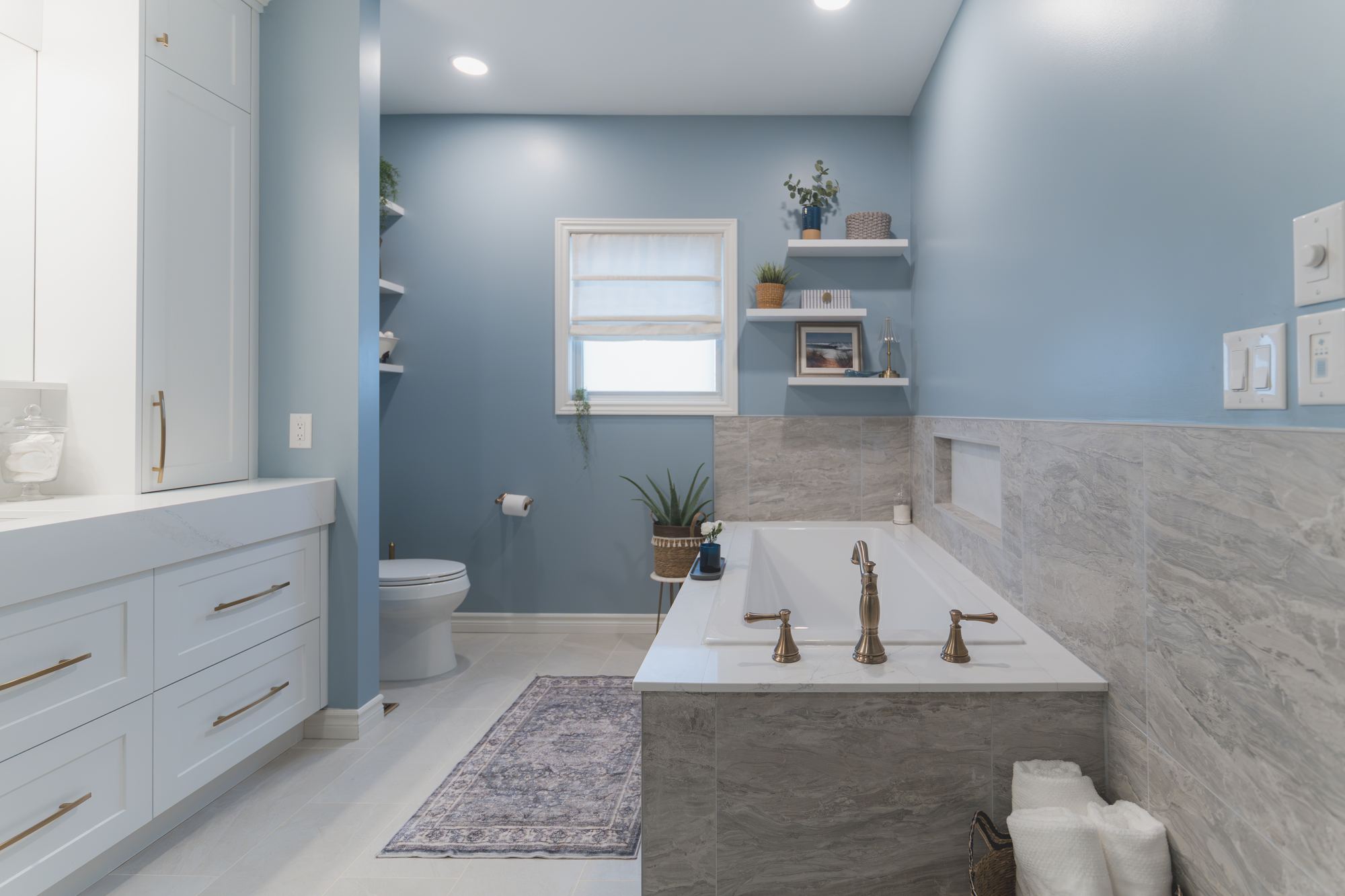 Renovated primary bathroom with soaking tub and brushed-gold fixtures, photographed for Bath Tune-Up of West London