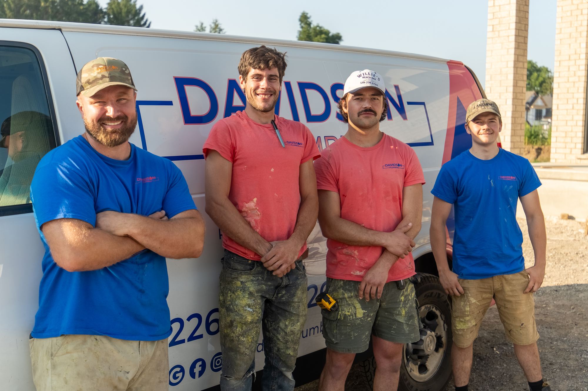 The Davidson Plumbing crew in front of their branded van, photographed by Mike Mala